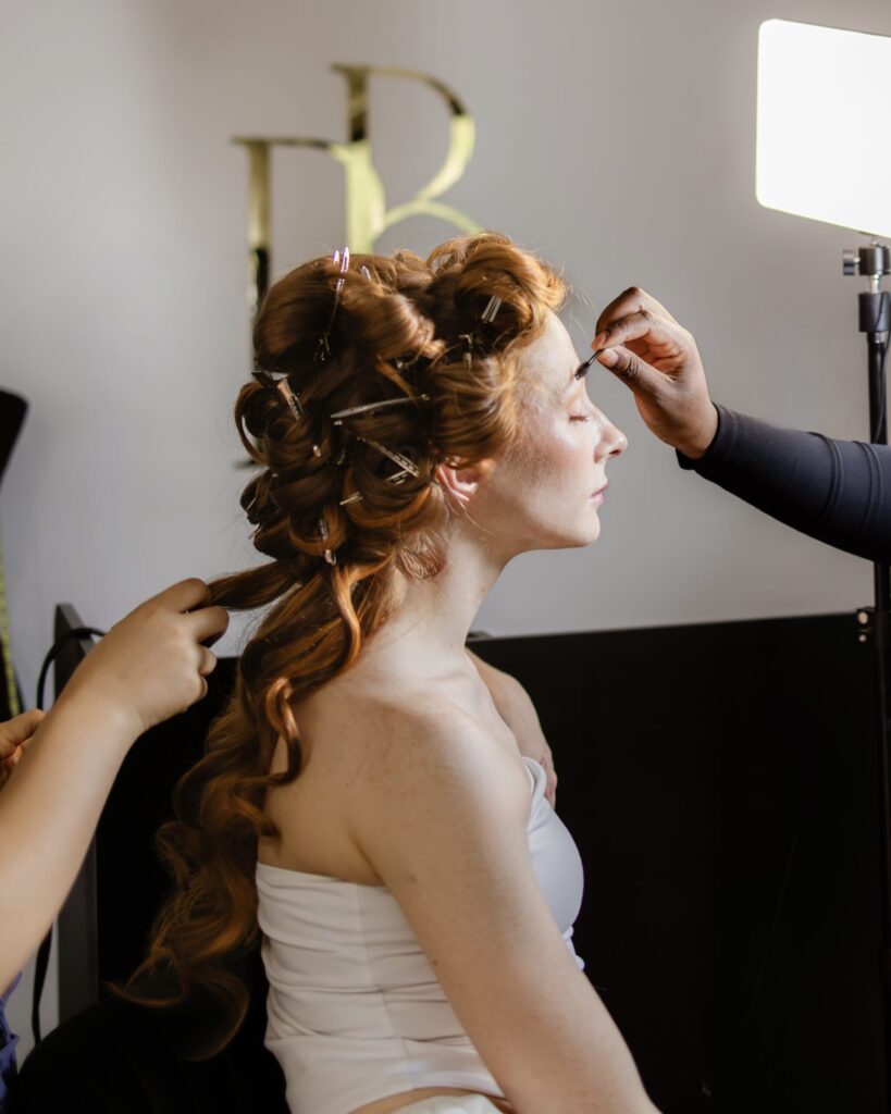 Michigan bridal model being styled by Jaya Ronquillo for a photoshoot.